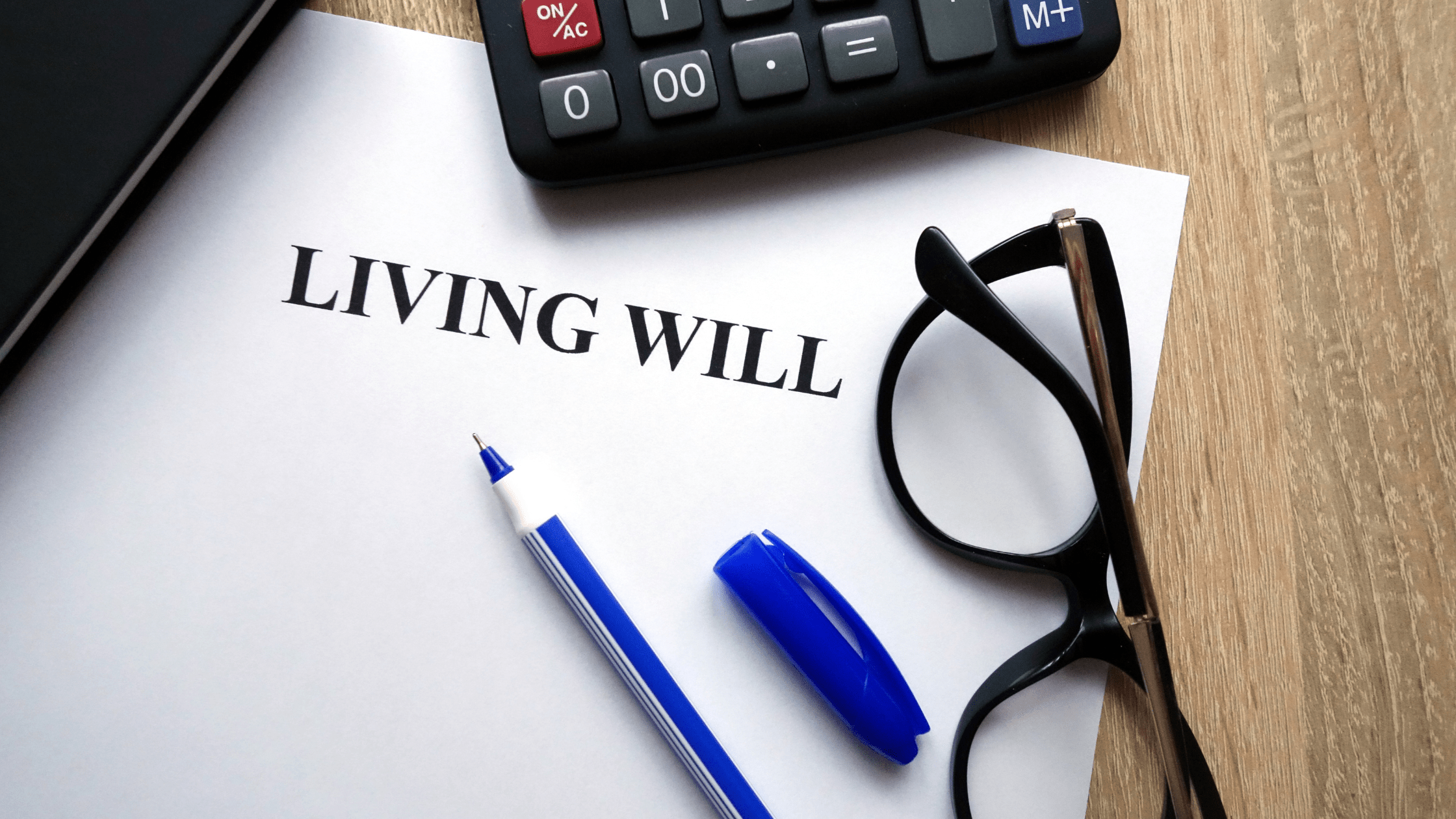 paper, glasses, pen, living will